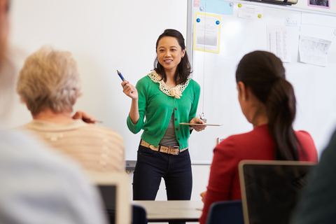 A presenter leading a professional learning workshop for educators